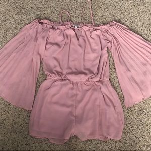 Pink off-shoulder pleated sleeve romper